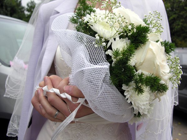 White carnations are included in this bridal bouquet.