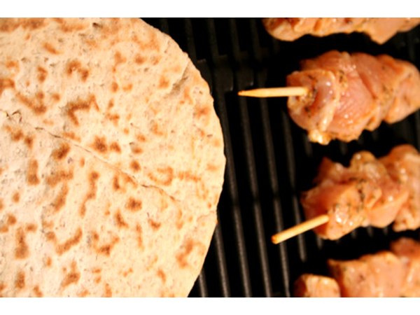 Outdoor grilling uses charcoal, wood or gas to cook food.