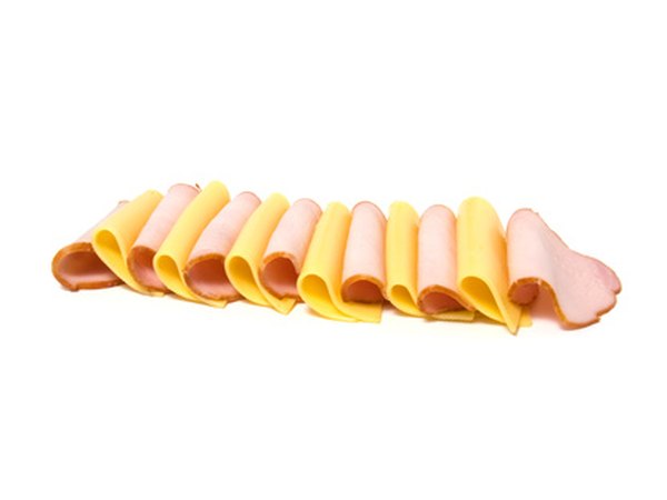 Cold cuts and cheese on a tray allow guests to make their own cracker sandwiches.