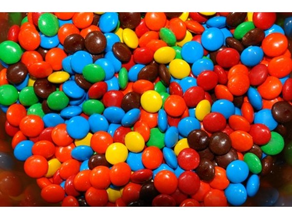 You can purchase candy with custom sayings and photos. How about "80s baby"?