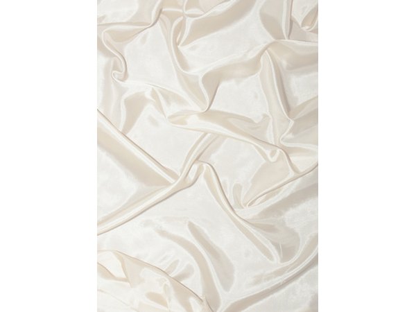 Drape the white material like snow.