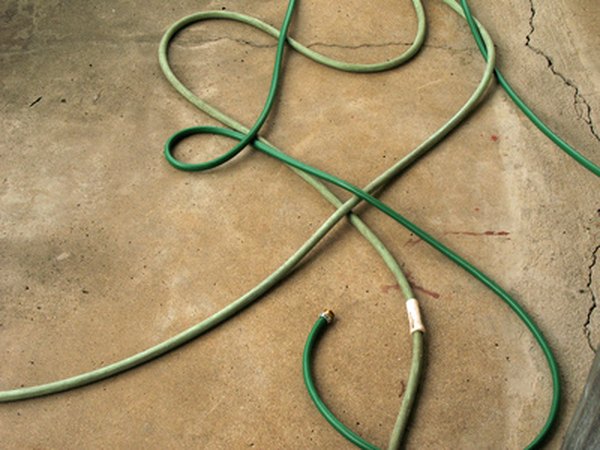 Cracks in a concrete driveway can be filled in with concrete resurfacing mixtures.