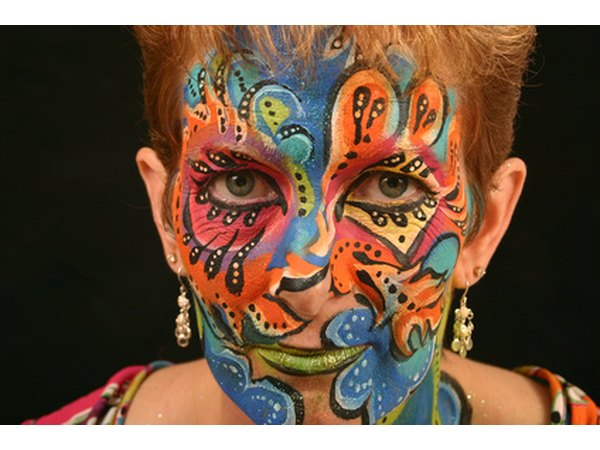 Face-painting can serve as a Mardi Gras mask.