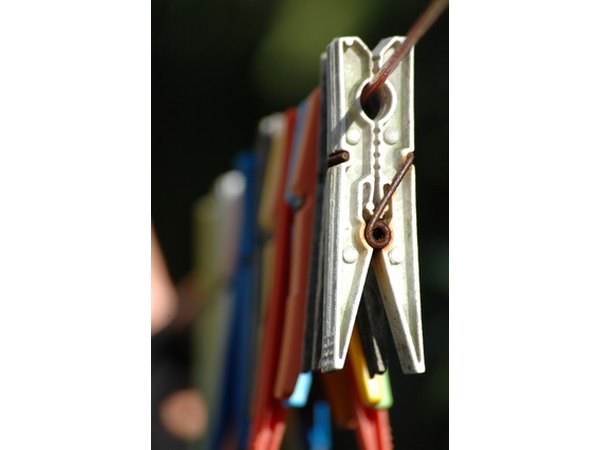 Purchase clothes pins to hang your clothes.