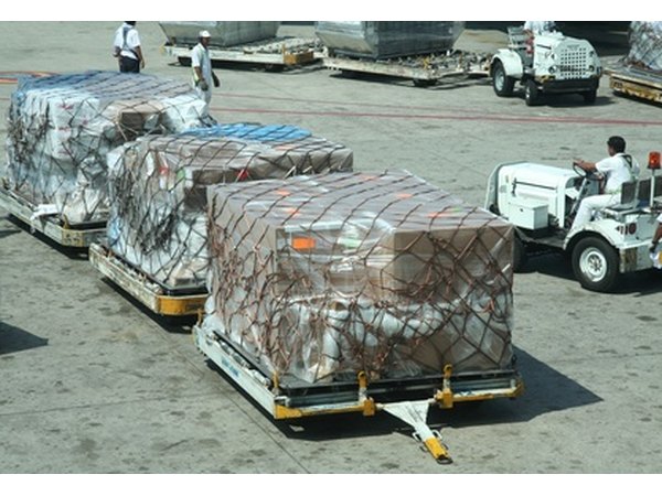 Ramp operations workers concentrate on loading baggage or other cargo