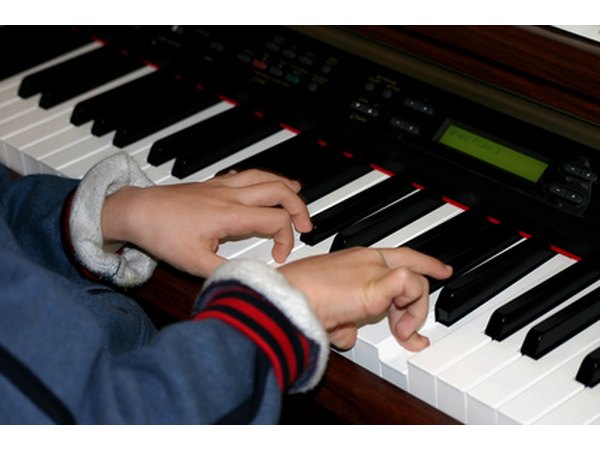 Students can progress to playing piano with both hands.