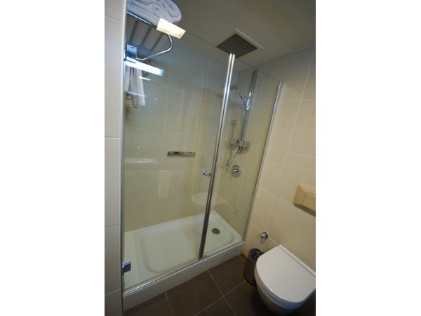 Remove soap scum and hard water with vinegar.