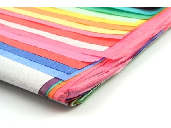 Use colorful tissue paper to create your paper mache mask.