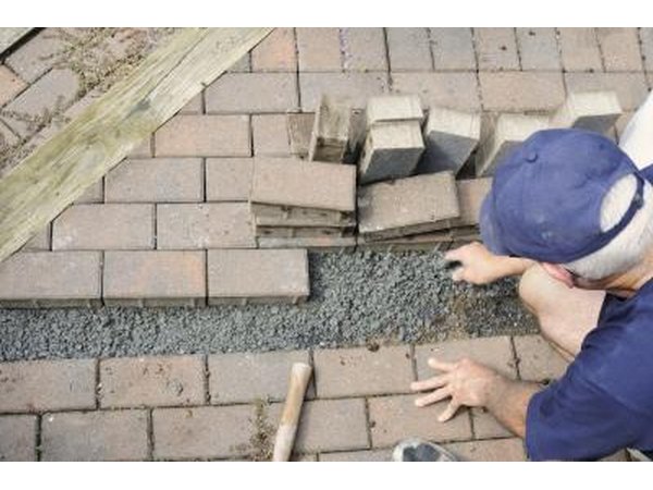 Construction workers installing brick