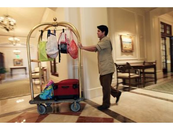 Bellman wheels luggage inside hotel