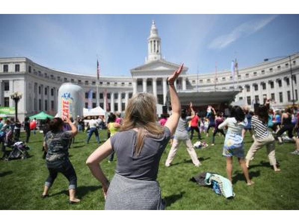 Women doing Zumba exercises at Civic Center Park in Denver, CO.
