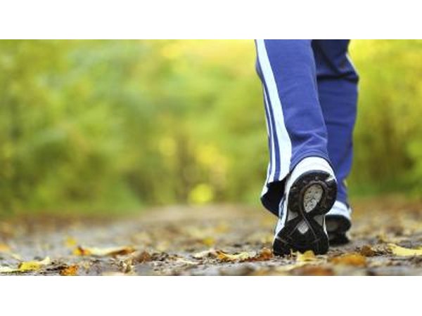 Woman walking on a trail in autumn