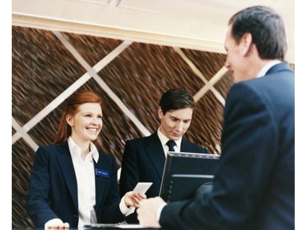 Man paying hotel bill