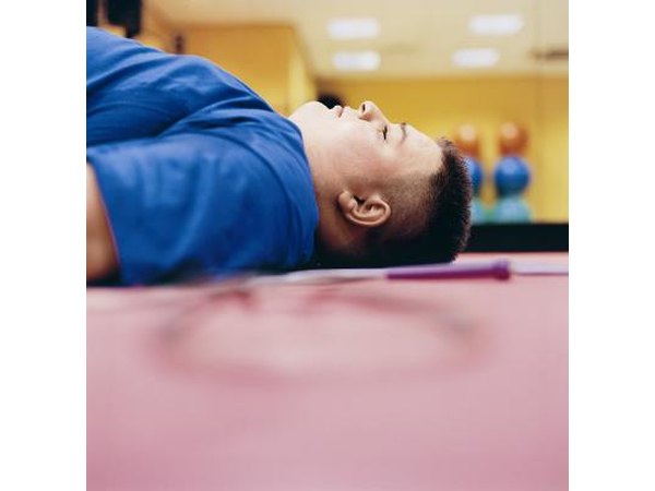 Large tired man lying on the floor