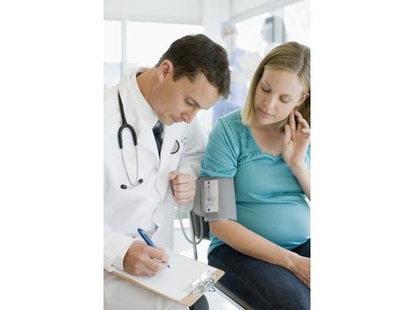 Pregnant woman consulting doctor