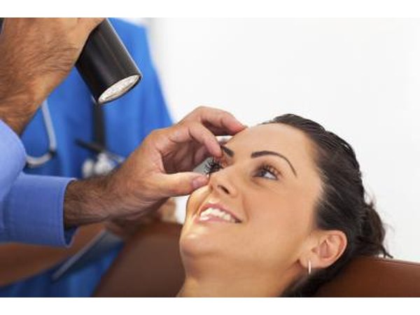 A doctor examining the eyes.