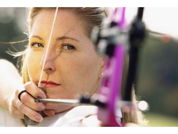 Woman aiming bow