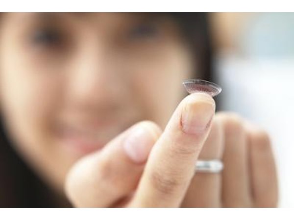 Contact lens on fingertip.