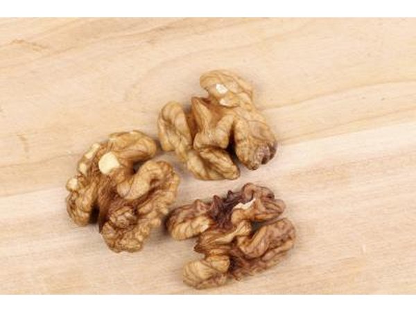 Three walnuts on wood table
