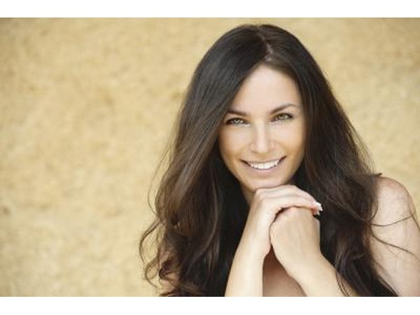 Young woman smiling with long hair.