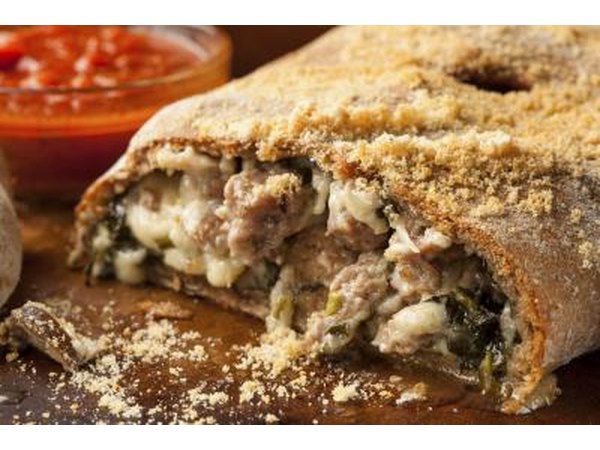 Homemade Italian Calzone with sausage and spinach