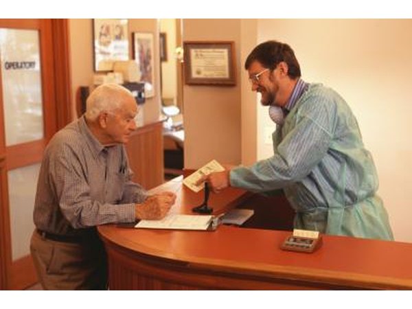 Dentist explaining cost to patient.