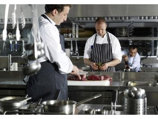 Chefs preparing the meat.