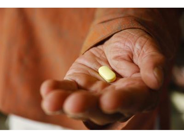 A man takes a supplement.