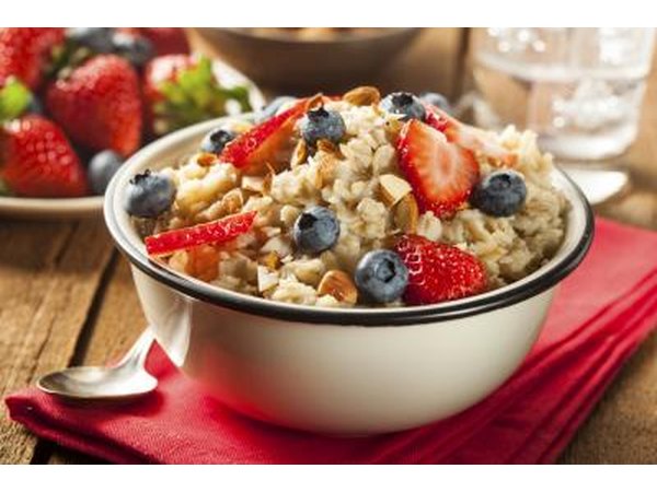 Bowl of healthy oatmeal with almonds and fruit.
