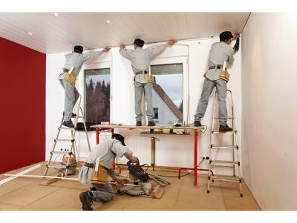 Repairmen working on home.