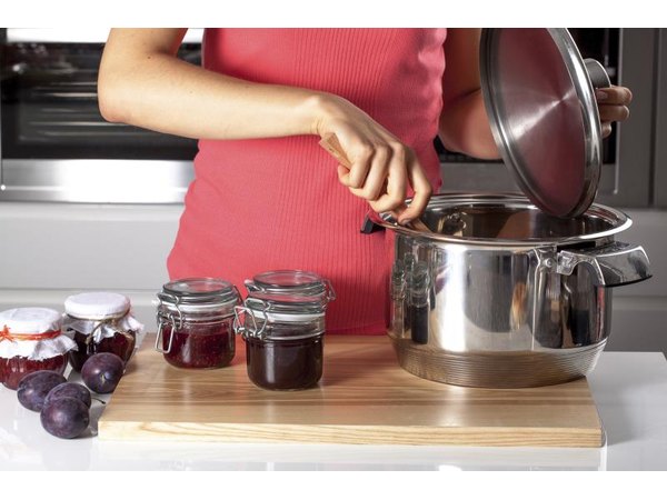Woman making jelly in her kitchen.