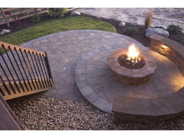 A stone bench and or fire pit can bring your pebble garden to life.