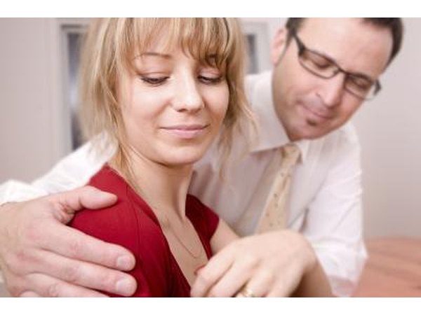 Man sexually harassing woman in office
