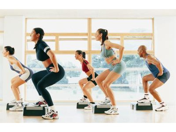 People taking an aerobic step class.