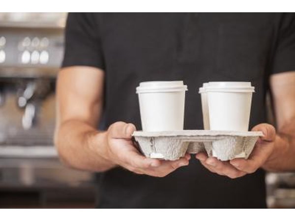 hipsters holding coffee cups