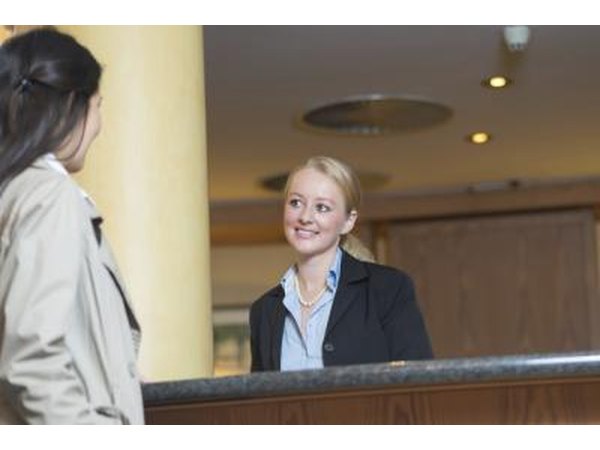 Woman checking in to hotel