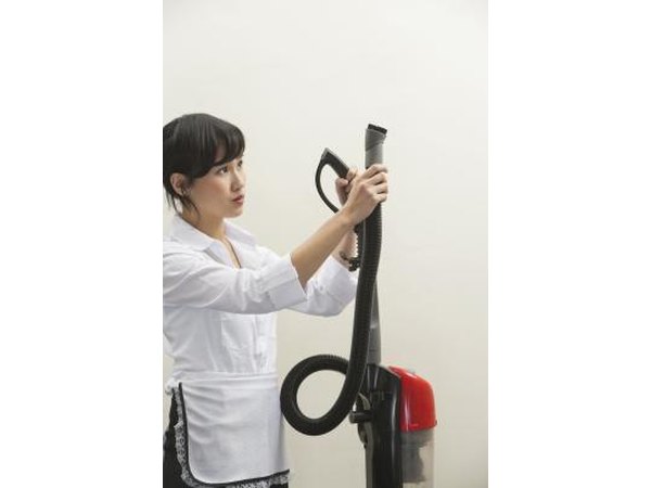 use a vacuum to remove dust from interior brick walls