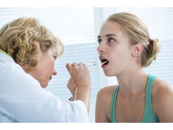 Doctor looking in patients mouth