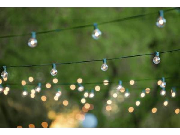 An outdoor area is decorated with gorgeous hanging lights