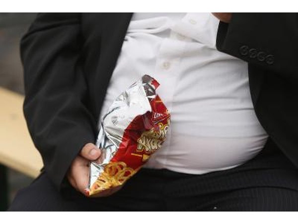 Man eating greasy snack food