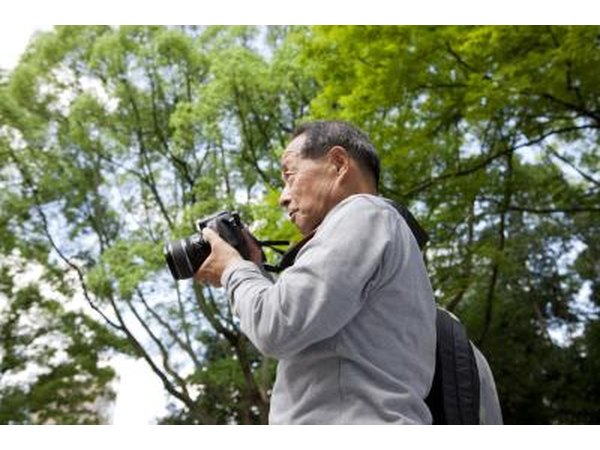 Senior man holding a digital camera