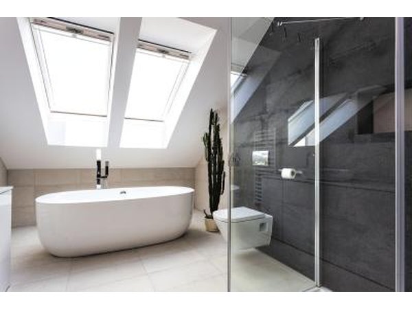 A contemporary bathroom with a gray wall.