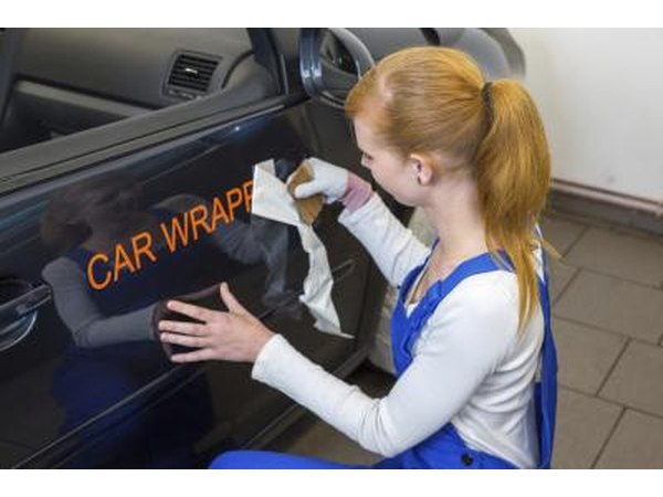 Vinyl decals advertise business on car