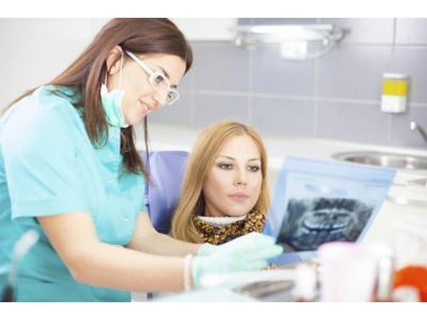 Dental hygenist with her patient