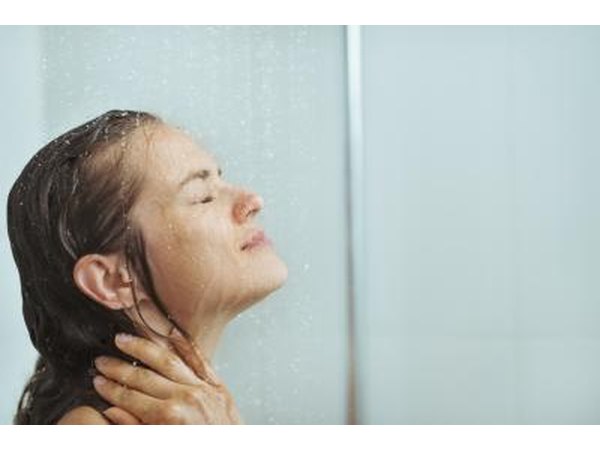 Woman relaxing in shower
