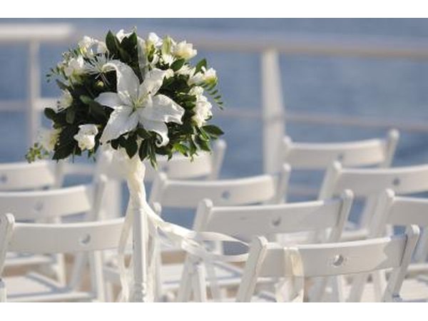Flowers and chairs arranged for wedding on a cruise ship