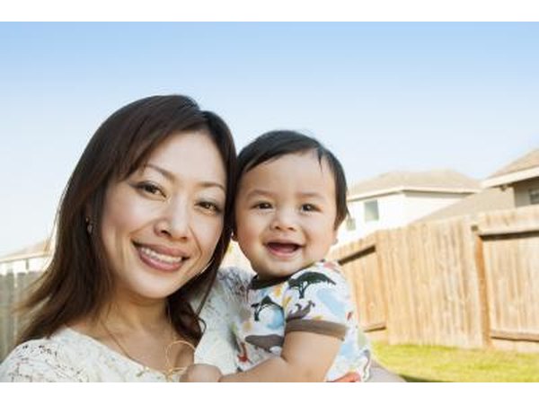 Mother and 6-month old son in backyard