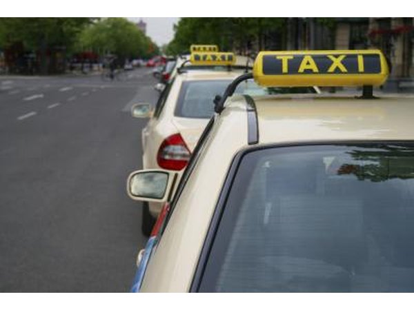 Taxi cars on the side of the road