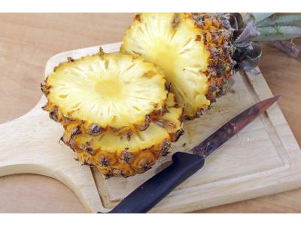 sliced pineapple on cutting board