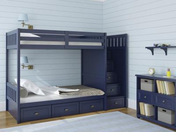 A children's room with navy blue furniture.